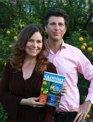 Lee and Lisa holding the Investments in Florida Book