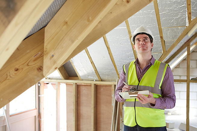 Man inspecting a building